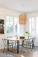 Large seagrass pendant light over dining table 