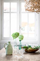 Green accessories on country dining table 