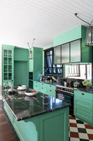 Green and black kitchen 