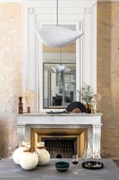 Large mirror over classic fireplace 
