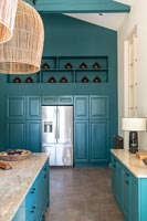 Modern country kitchen with teal painted woodwork