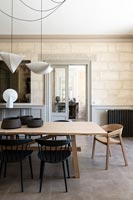 Modern dining room with exposed stone walls 