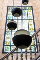 Modern pendant lights and stained glass window 