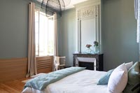 Aqua blue painted modern bedroom with period features 