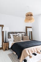 White bedroom with black and brown accessories 