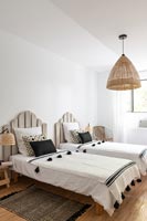 Twin beds with rustic wooden headboards 
