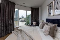 Modern bedroom with view of river