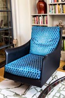 Blue patterned fabric on modern armchair 
