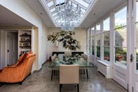 Modern dining room in glazed extension 