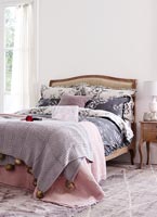 Country bedroom with patterned bedding 