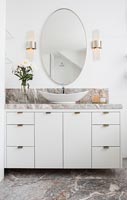 Sink unit in white bathroom with marble floor 