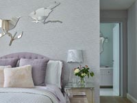 Modern bedroom with bird shaped mirrors 