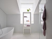 White modern bathroom with purple accessories 