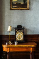 Classic carriage clock on console table 