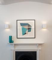 Modern artwork over fireplace 