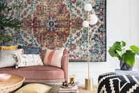 Rug as wall hanging in modern country living room 