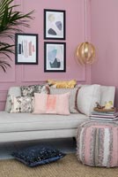 Pink painted wooden paneled wall in modern living room 
