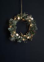 Christmas wreath against black background 