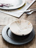 Black and white crockery on dining table 