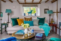 Country living room with teal and turquoise accessories 