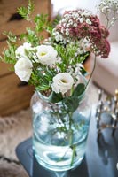 Flower arrangement in glass vase 