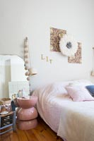 Modern bedroom with pink bedside table 