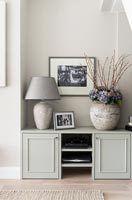 Large vase and ceramic lamp on built-in cabinet 
