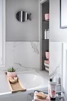 Grey modern bathroom with pink accessories 