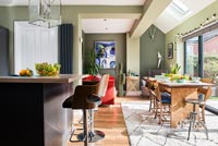 Green painted modern dining room 