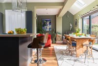 Green painted modern dining room 