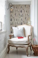 Bookcase wallpaper in alcove of country living room 