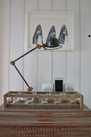 Vintage desk lamp and painting of mackerel fish
