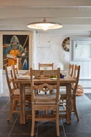 Wooden dining table and chairs in country dining room 