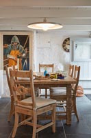 Wooden table and chairs in country dining room 