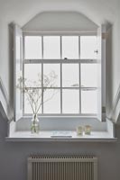 White shutters on windows with sea views 
