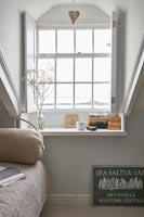 Coastal view through window with shutters - country cottage 