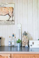 Corks in vintage jar on kitchen worktop 