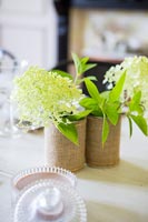 Flowers in hessian covered pots 