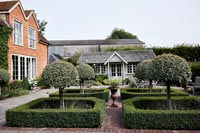 Formal front garden and country house 