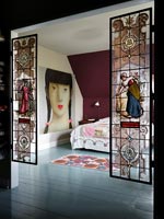 Stained glass screens in bedroom doorway 