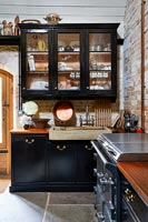 Black country kitchen with stone sink 