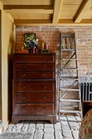 Tallboy chest of drawers in country bedroom 