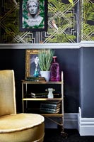 Gold trolley as side table in eclectic living room 