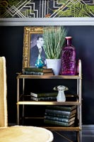 Gold trolley as side table in eclectic living room 