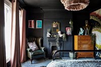 Eclectic black painted bedroom 