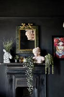 Black painted walls and fireplace 