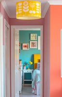 View from hallway into colourful modern bedroom 