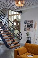 Staircase in open plan living space with view to childrens play area