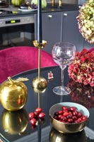 Gold ornaments on small dining table in kitchen-diner 