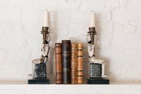 Classic candle sticks with books 